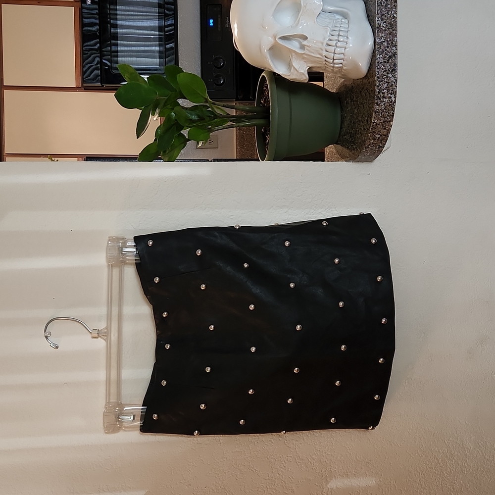 Studded leather skirt.